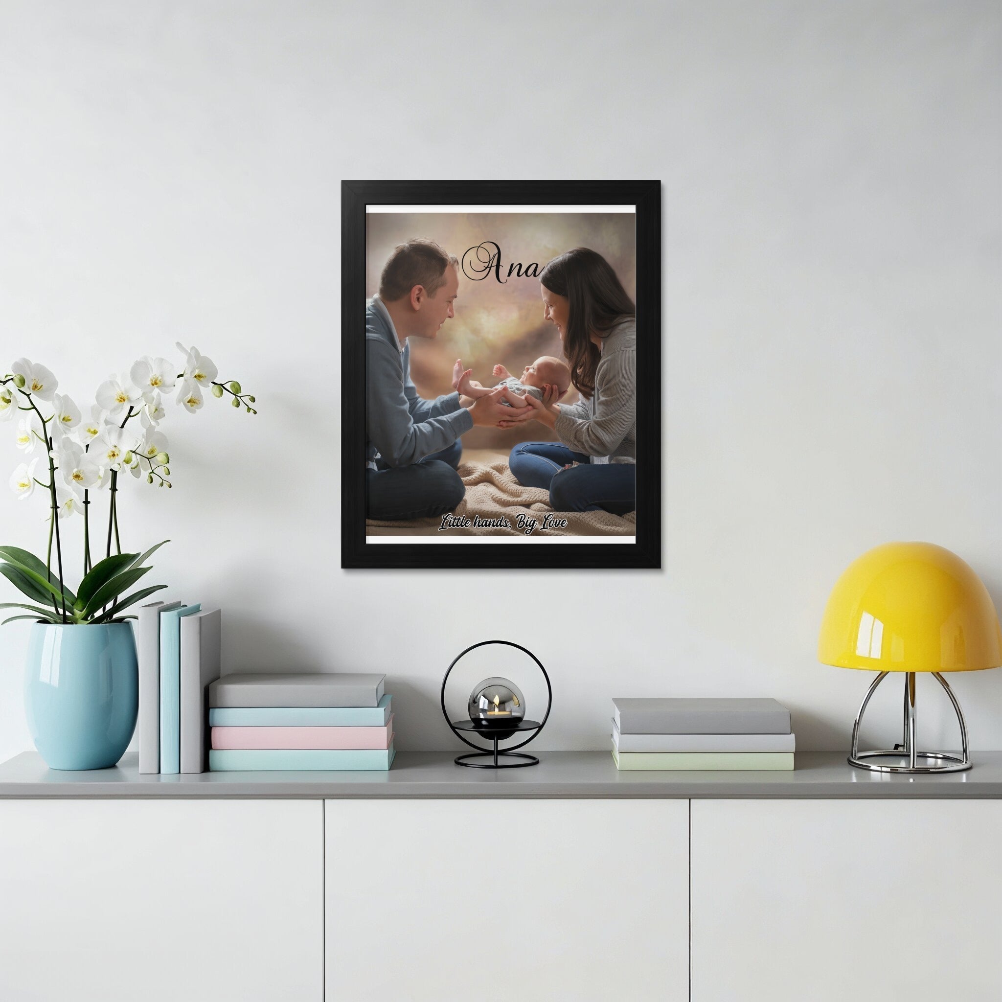 Framed portrait of parents holding newborn baby, "Little hands, big love".
