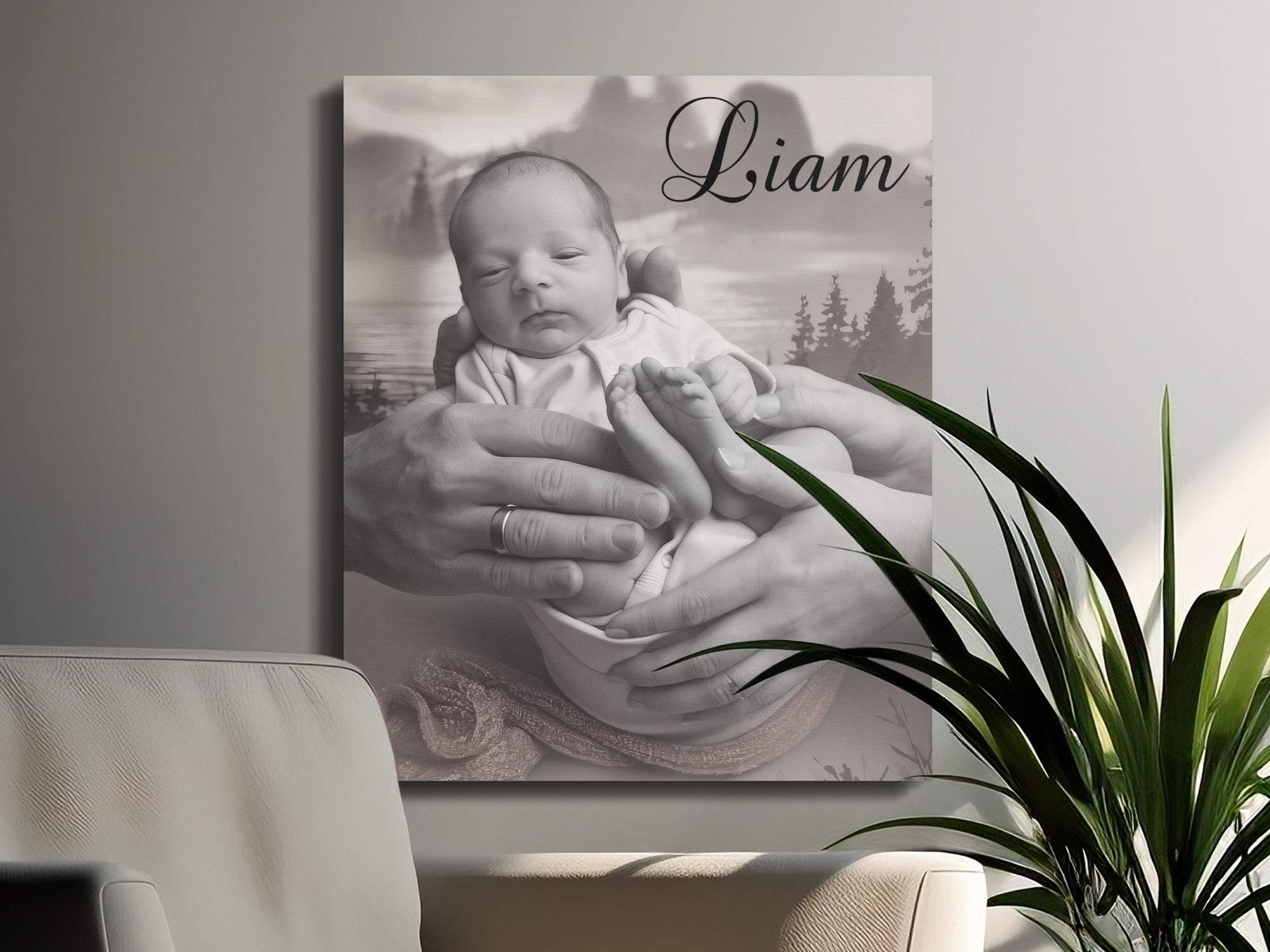 Black and white canvas print of a baby held by parents' hands, with "Liam" in script.