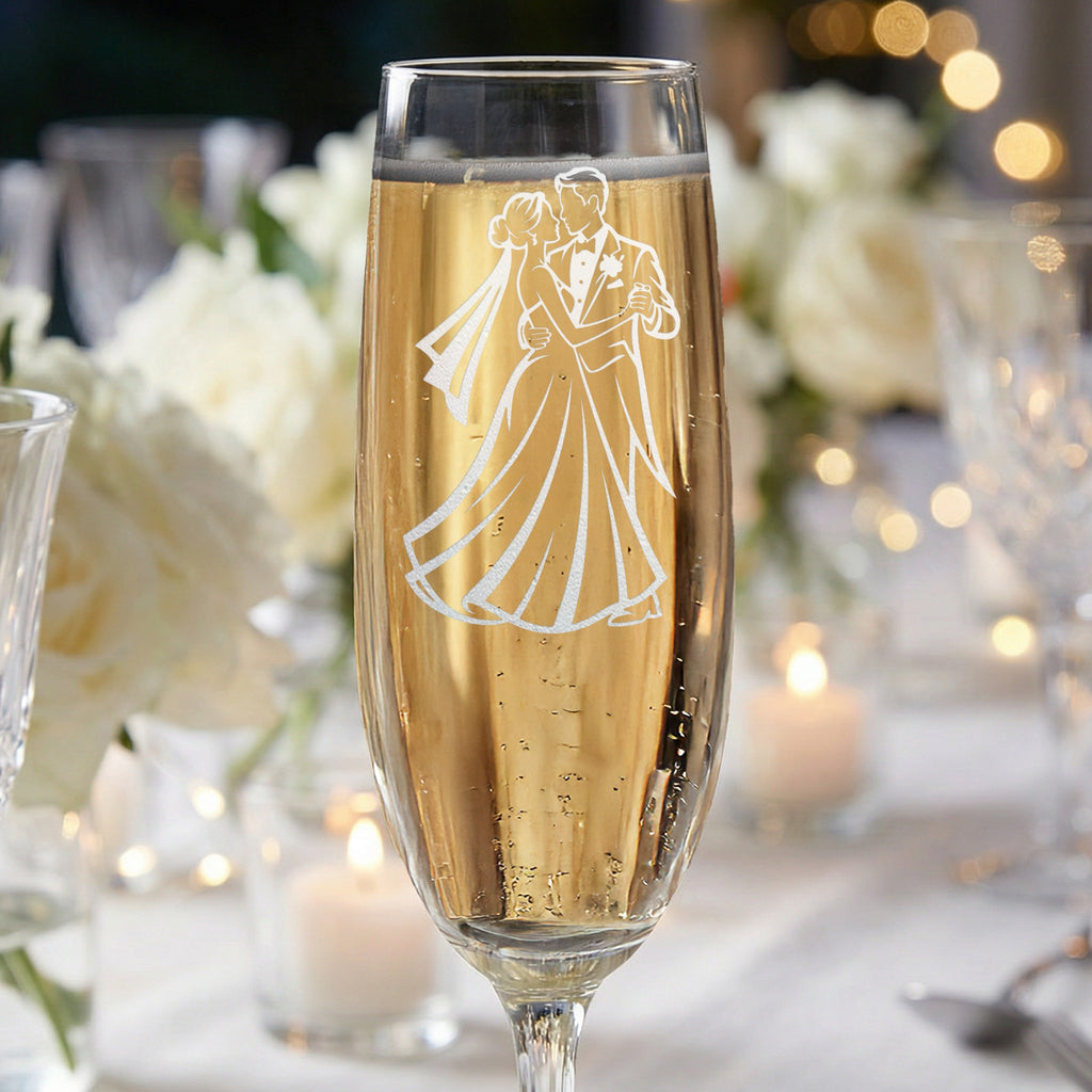 Champagne flute with etched silhouette of dancing couple, wedding champagne.