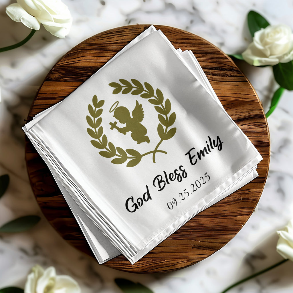 White cloth napkins with gold angel and laurel wreath design, "God Bless Emily 09.25.2025".