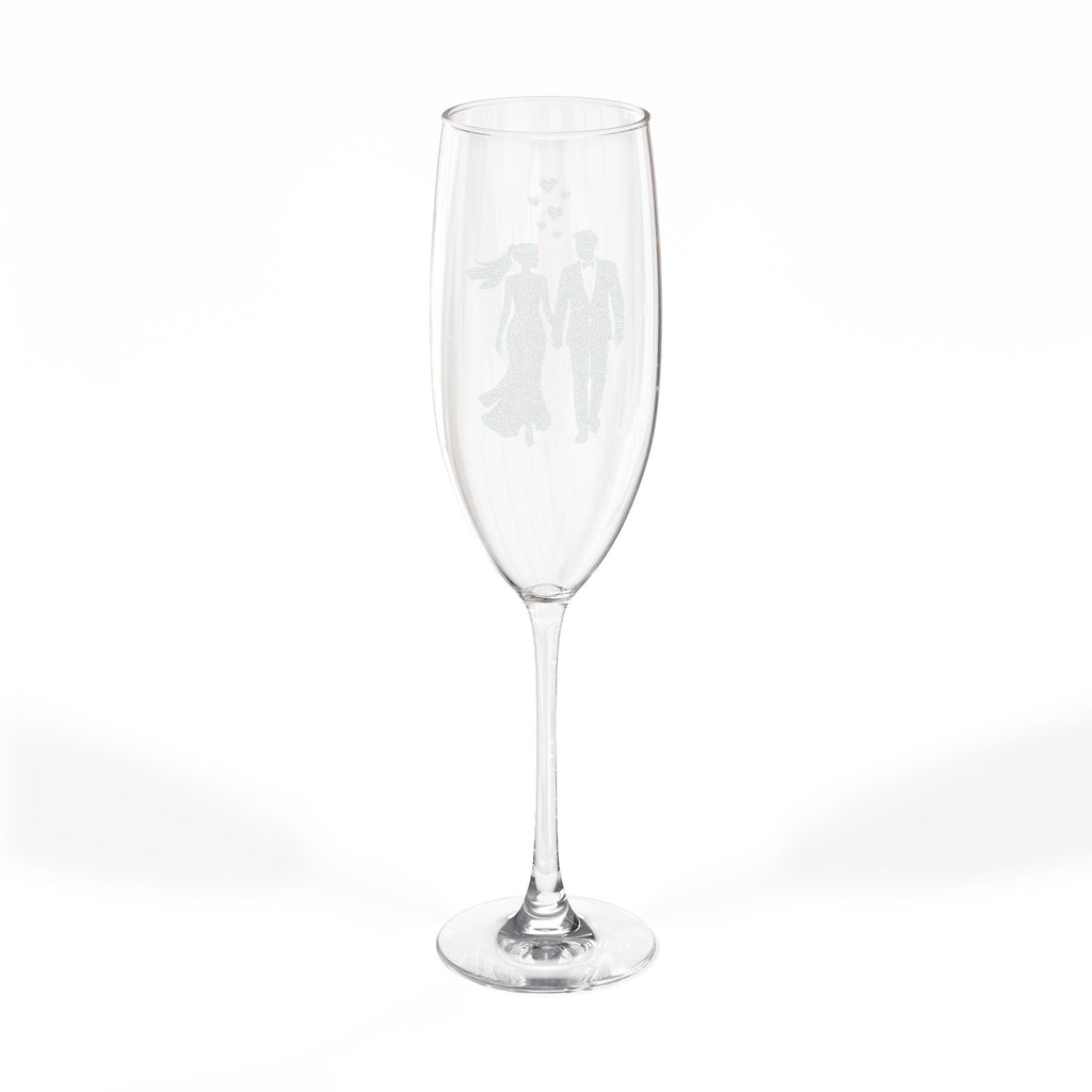 Champagne flute with etched silhouette of a bride and groom.