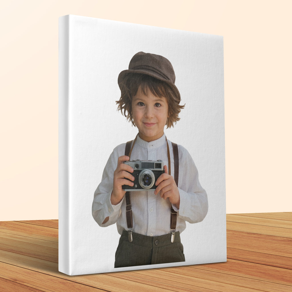 Boy in vintage clothing wearing a hat and holding an old camera.