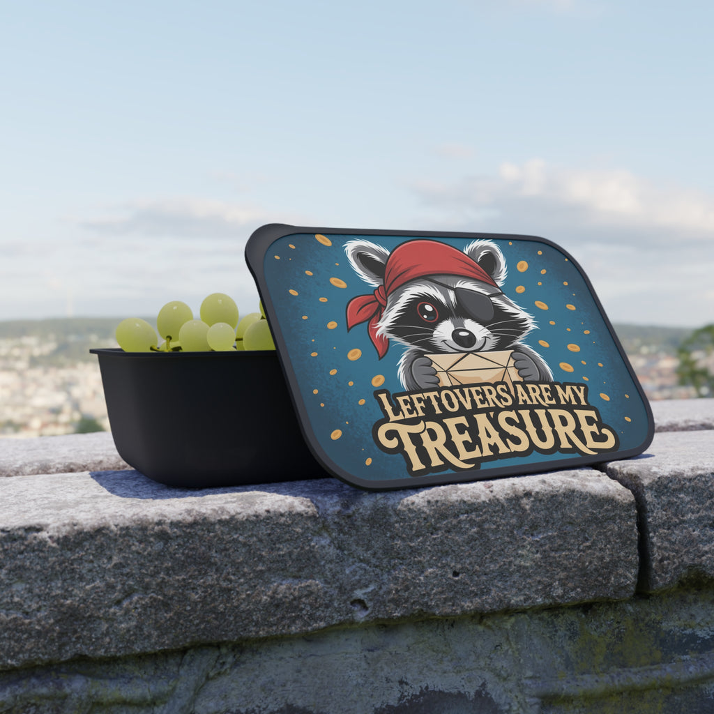Black lunchbox with a raccoon wearing a bandana and holding a treasure chest.