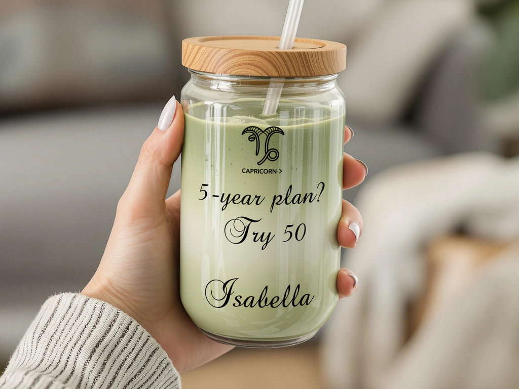 Glass jar with wooden lid, straw, and "5-year plan? Try 50 Isabella" text.