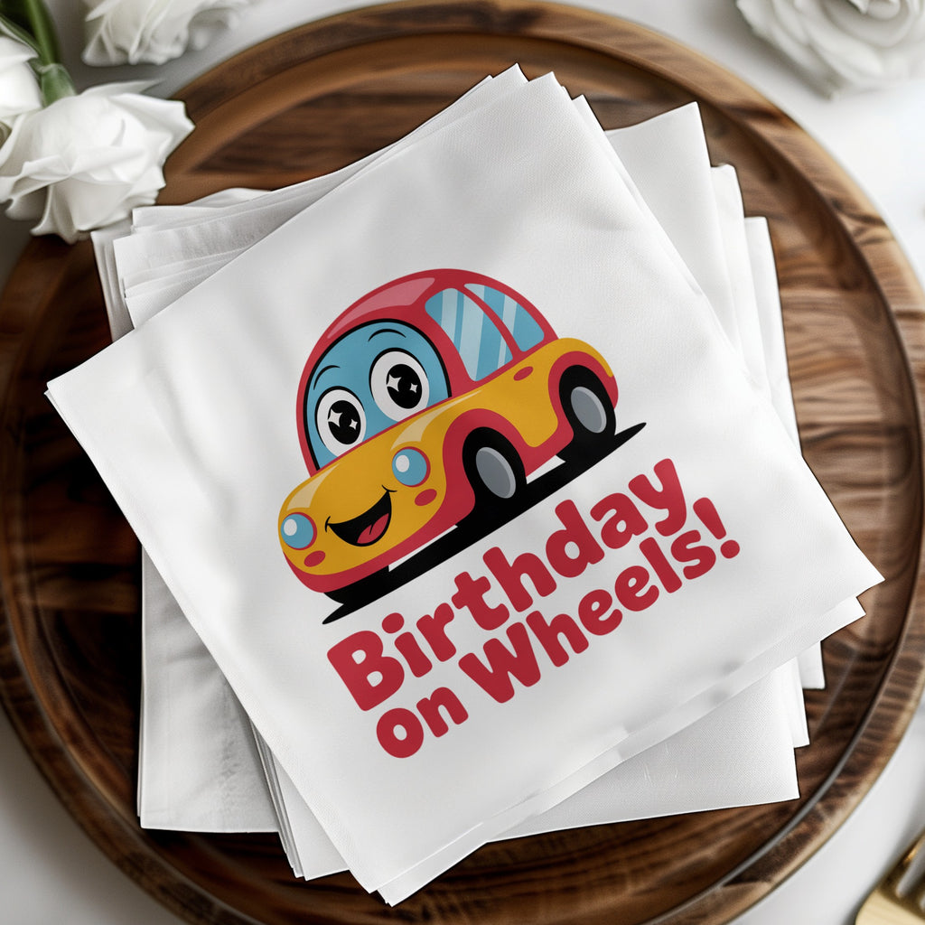 Yellow toy car with "Birthday on Wheels!" text on napkins.