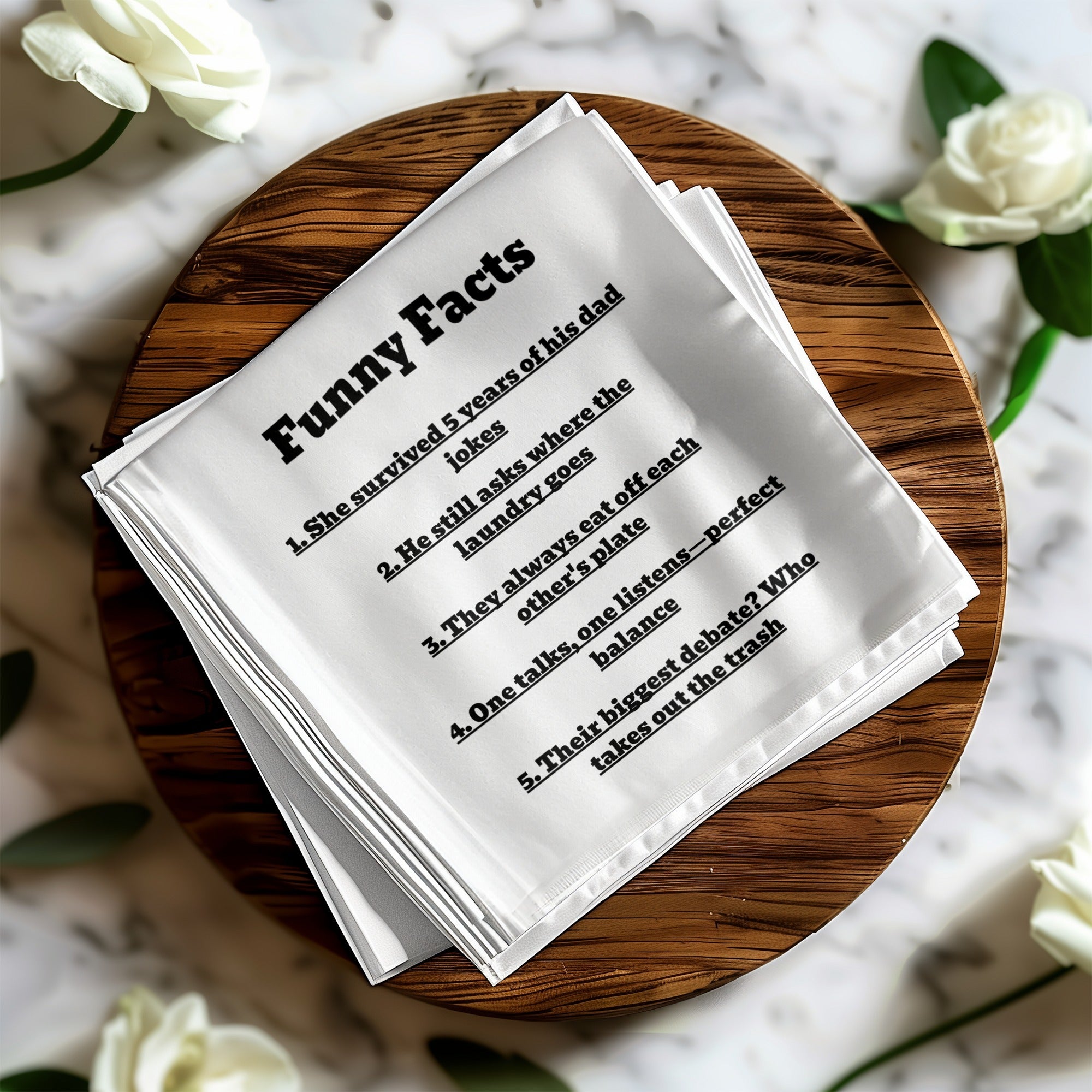 White linen napkin with "Funny Facts" and numbered jokes about a relationship.