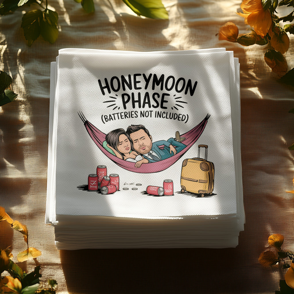 Napkins with cartoon couple in hammock, text "Honeymoon Phase" and travel items.