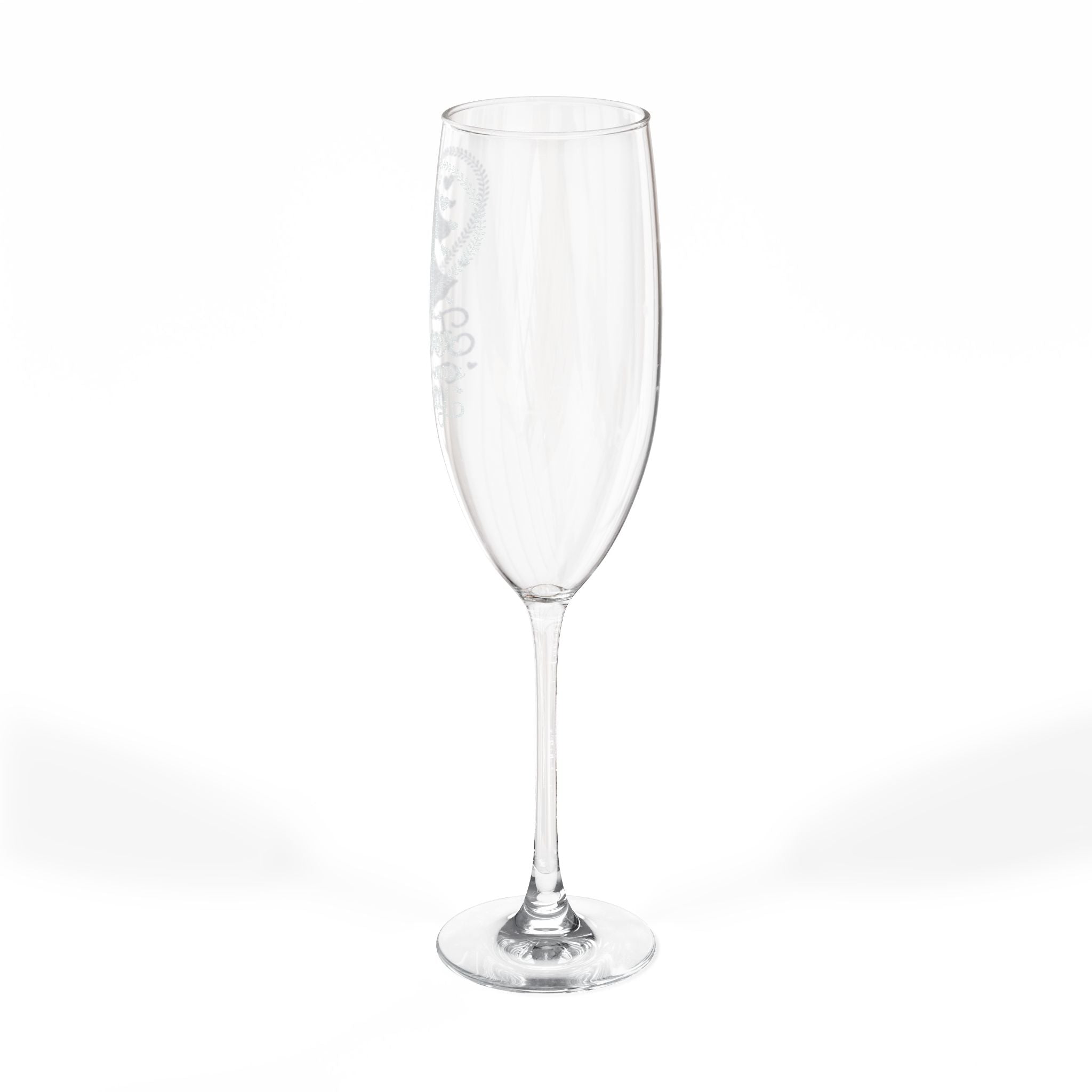 Clear champagne flute with etched heart design on stem.