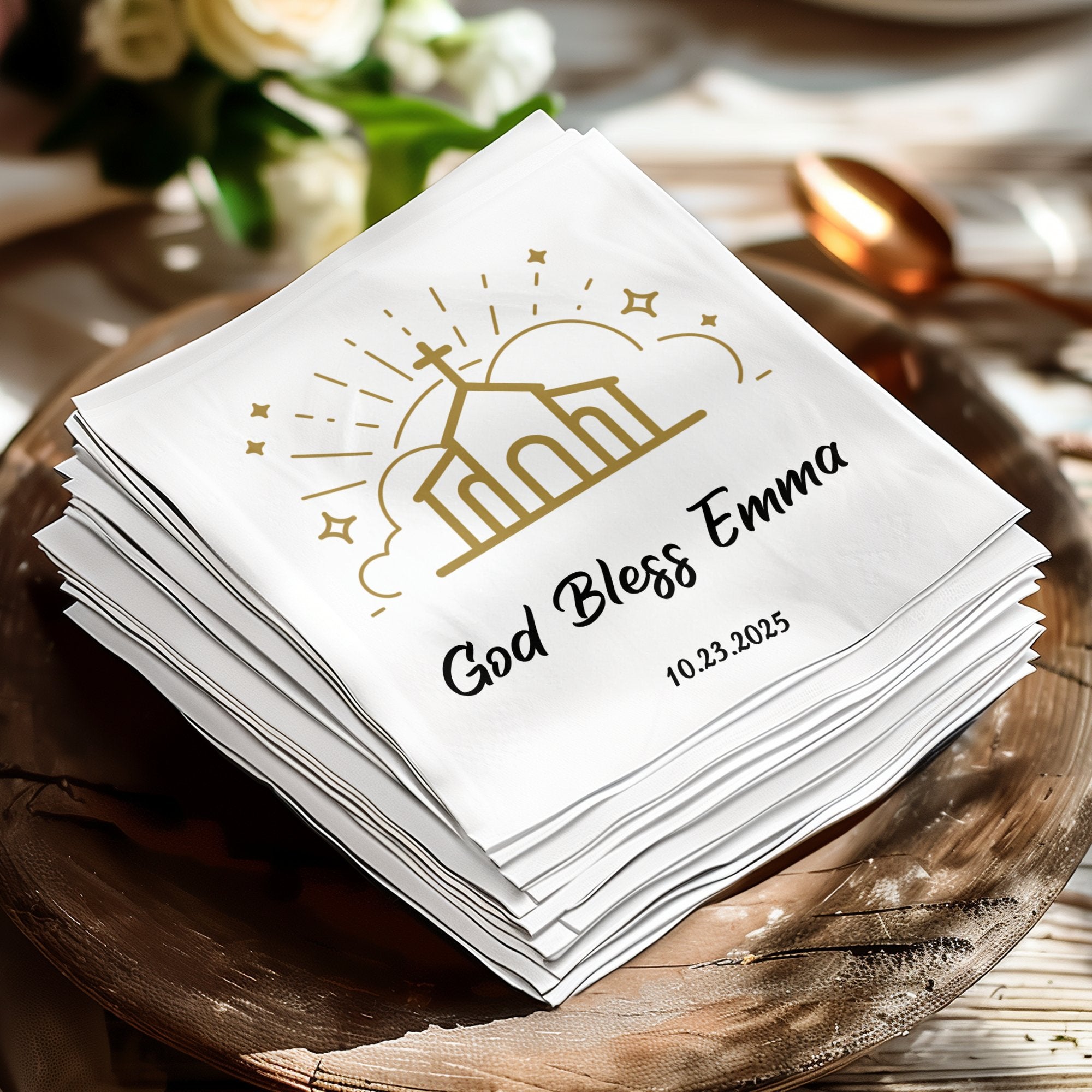 White napkin with "God Bless Emma" and date.