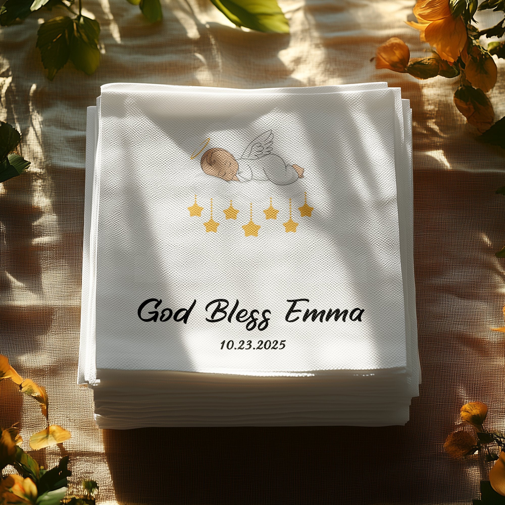 White cocktail napkins with "God Bless Emma" and "10.23.2025" printed in black.