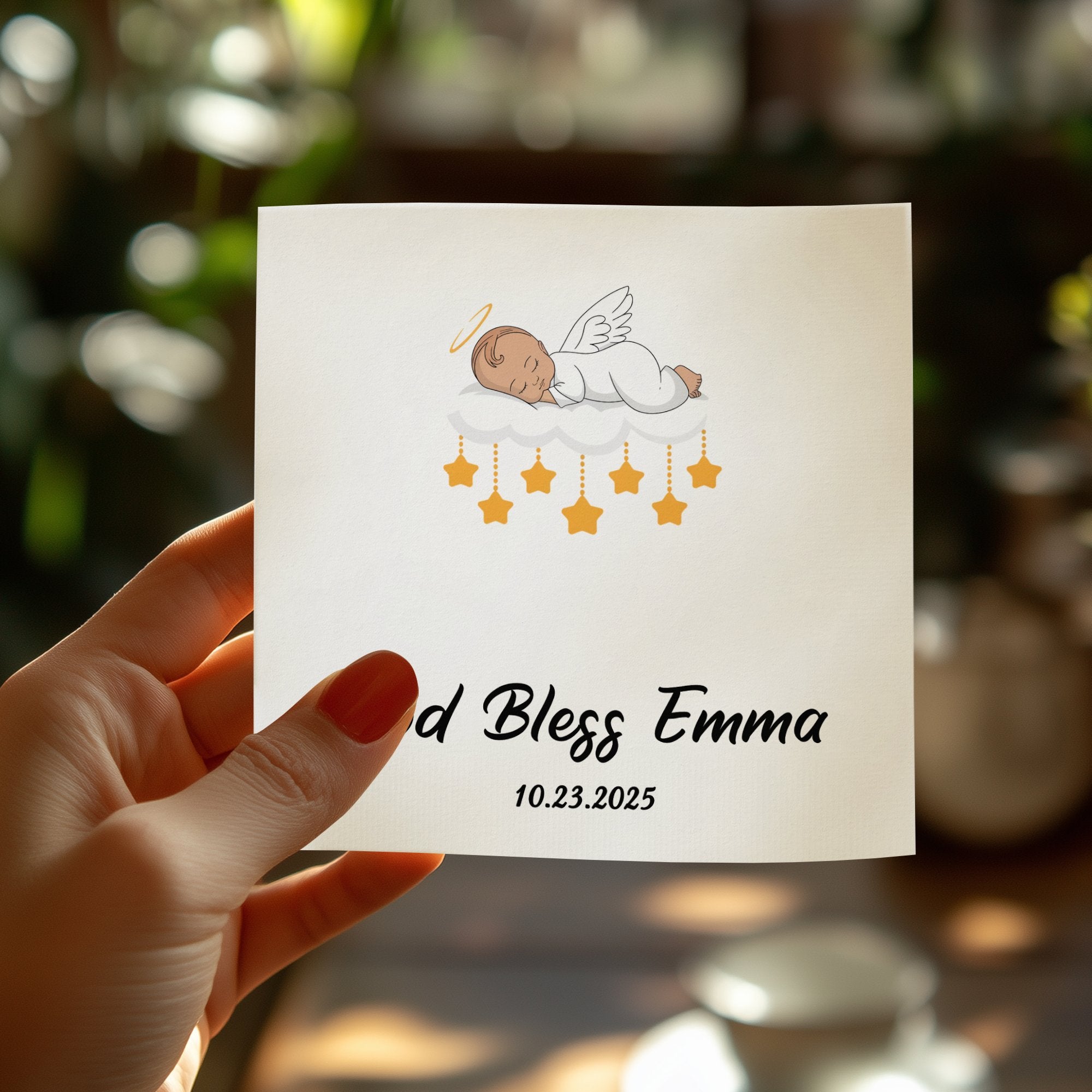 Baptism card with baby angel, stars, and text "God Bless Emma 10.23.2025".