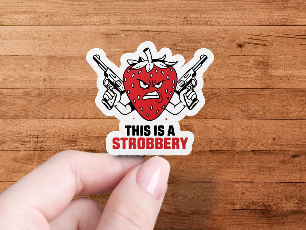 Strawberry with guns and text "THIS IS A STROBERRY" sticker.
