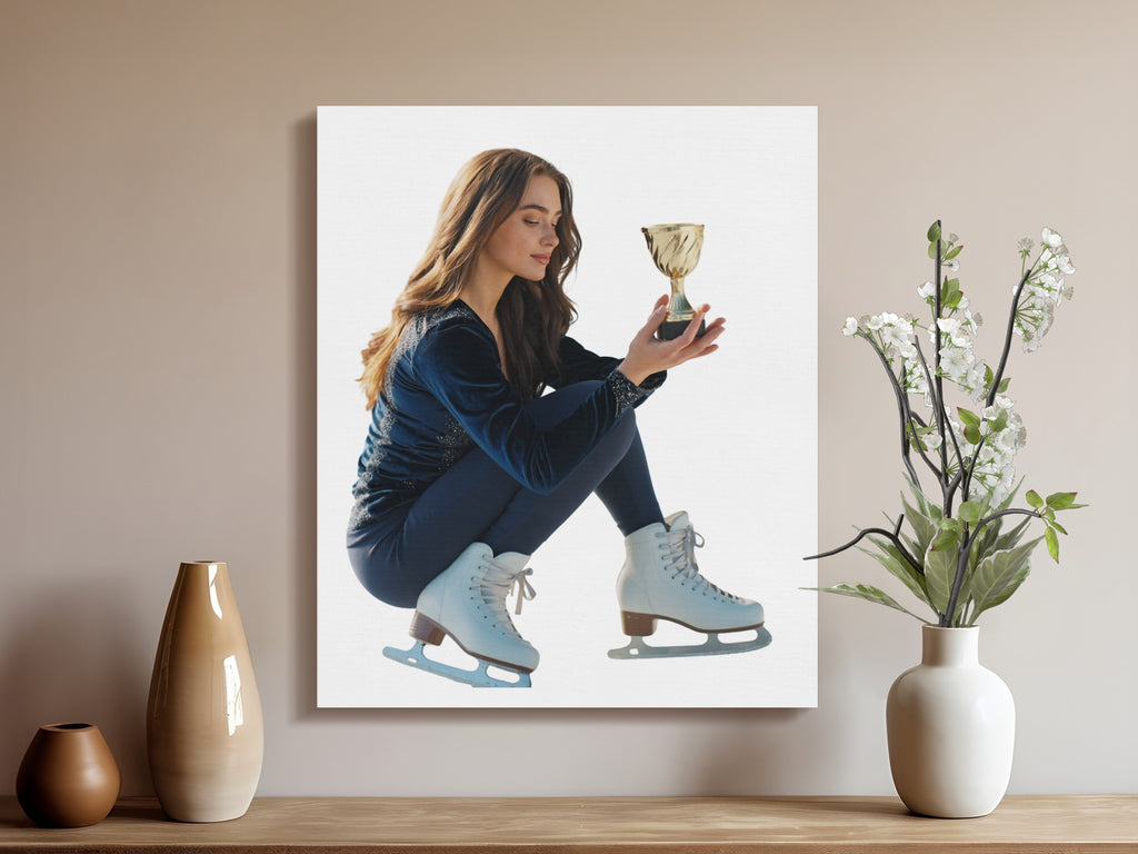 Figure skater in white skates holds gold trophy, seated indoors with vases.