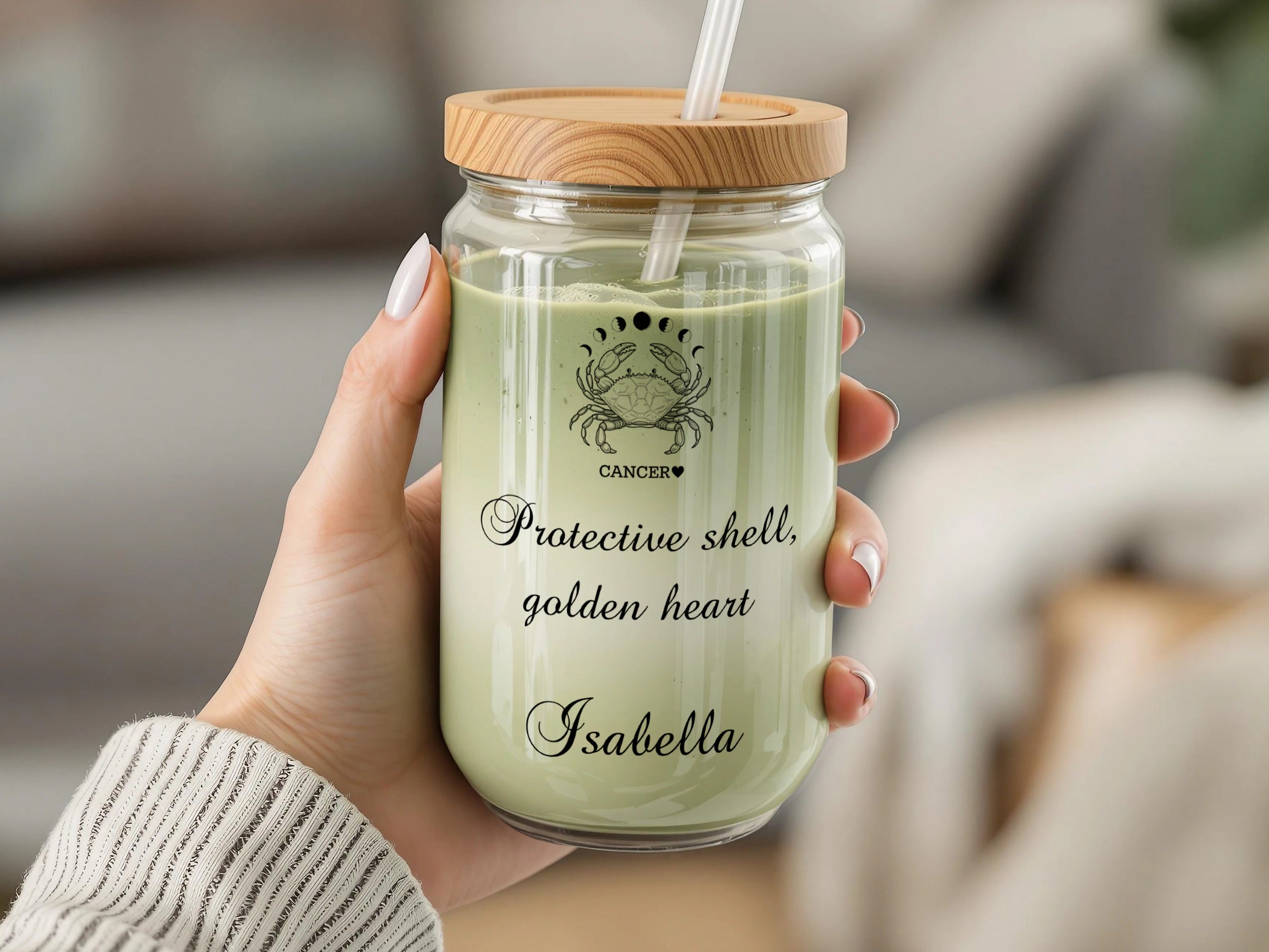 Cancer zodiac symbol with text "Protective shell, golden heart Isabella".