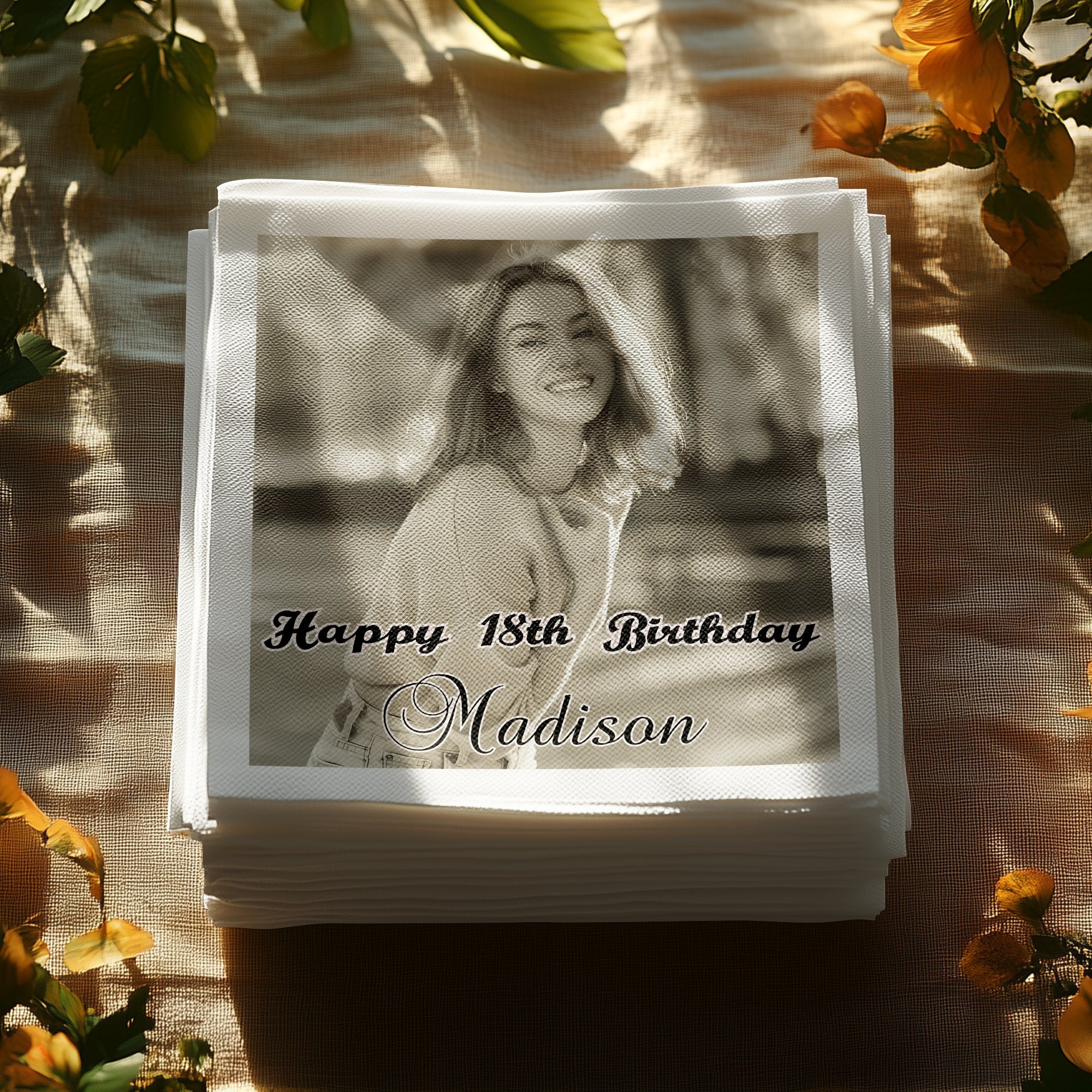 Stack of personalized napkins with a woman's photo and "Happy 18th Birthday Madison".