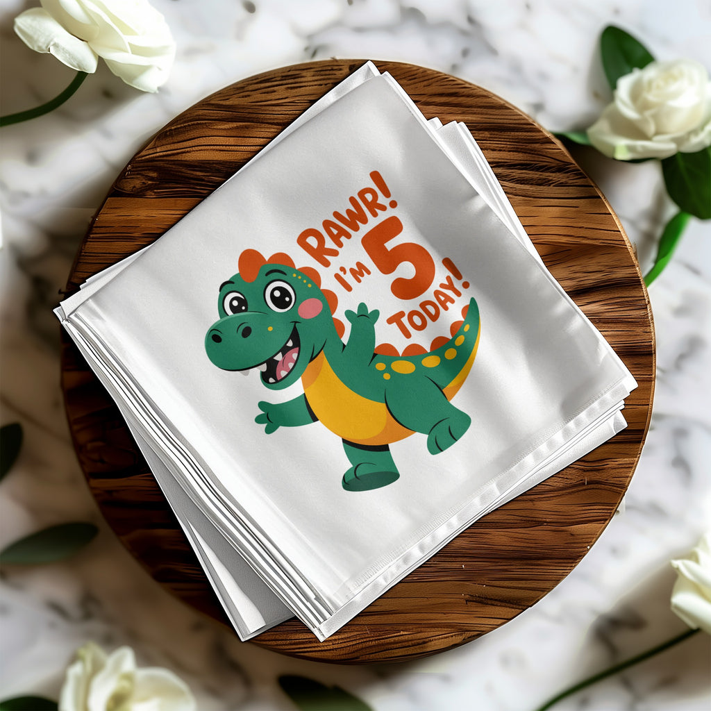 Green dinosaur graphic on white napkin with text "RAWR! I'm 5 TODAY!".