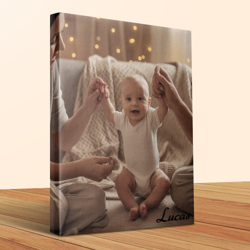 Baby in white onesie held by parents with "Lucas" text.