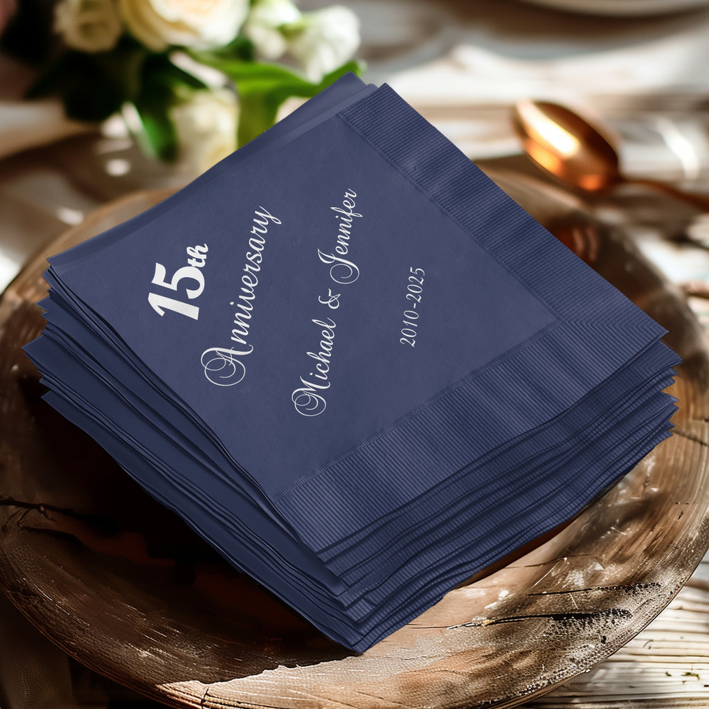 Stack of navy blue napkins with "15th Anniversary Michael & Jennifer 2010-2025" text.