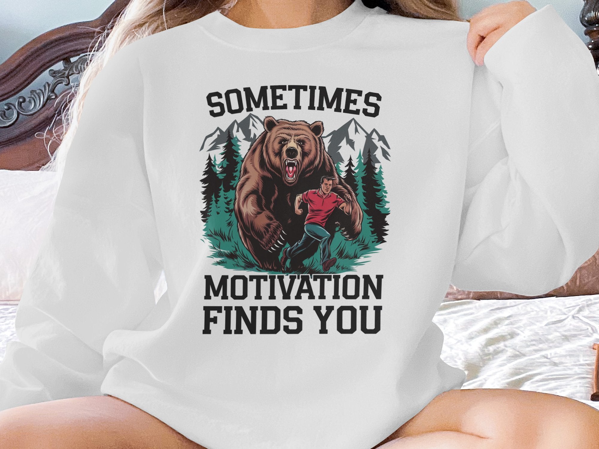 Bear chasing a man with text "Sometimes Motivation Finds You."
