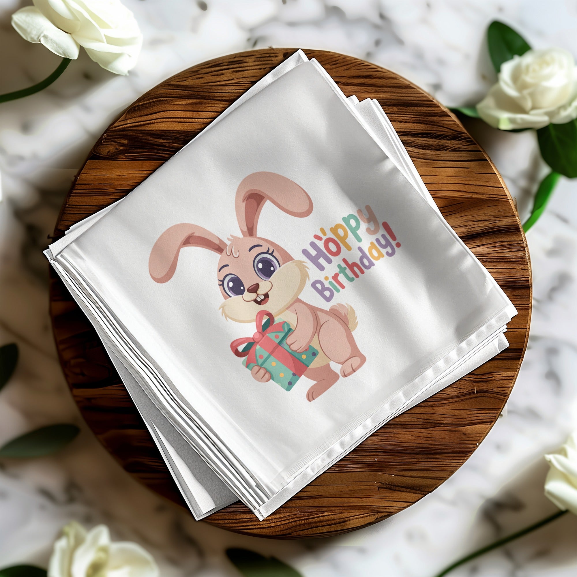 White bandana with a cartoon bunny holding a gift box and "Hoppy Birthday!" text.