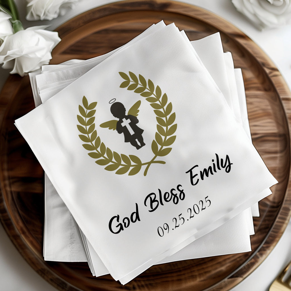 White napkins with "God Bless Emily 09.25.2025" and a haloed figure.