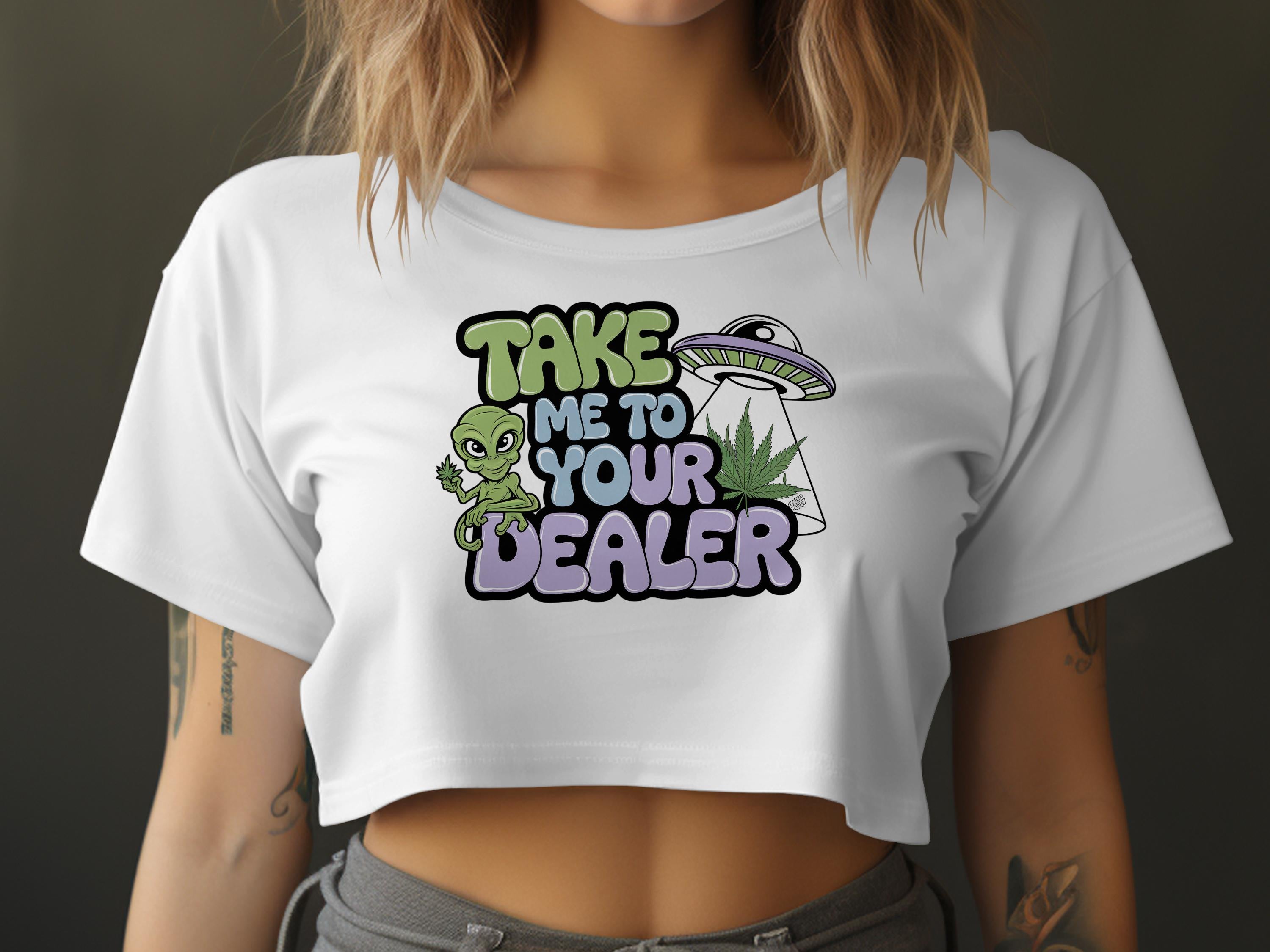 White crop top with alien, UFO, and marijuana leaf graphic and text.