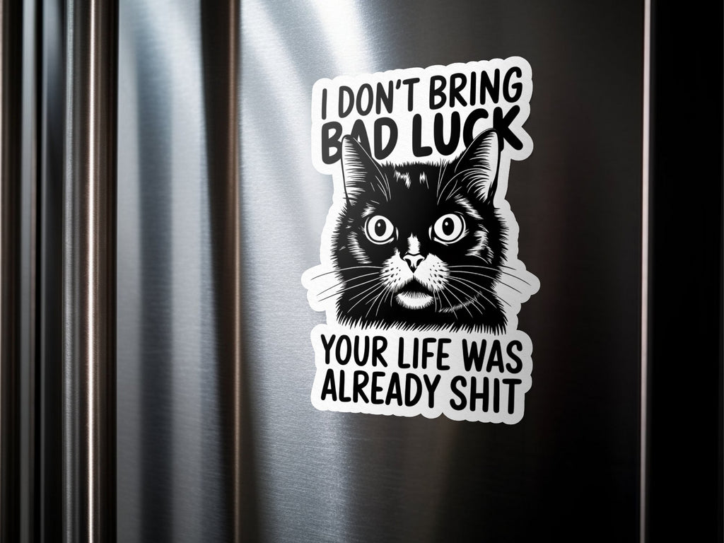 Black cat sticker on a metallic surface with text "I don't bring bad luck your life was already shit".