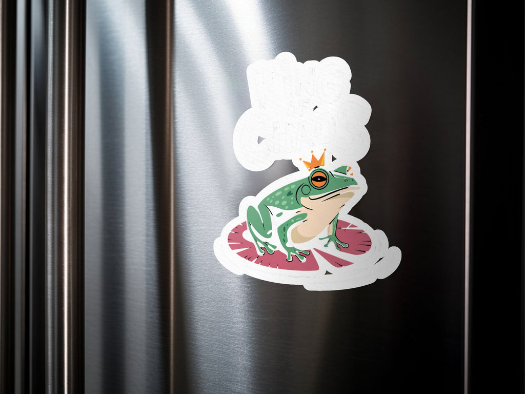 Cartoon frog wearing a crown sits on a lily pad, sticker on a refrigerator.