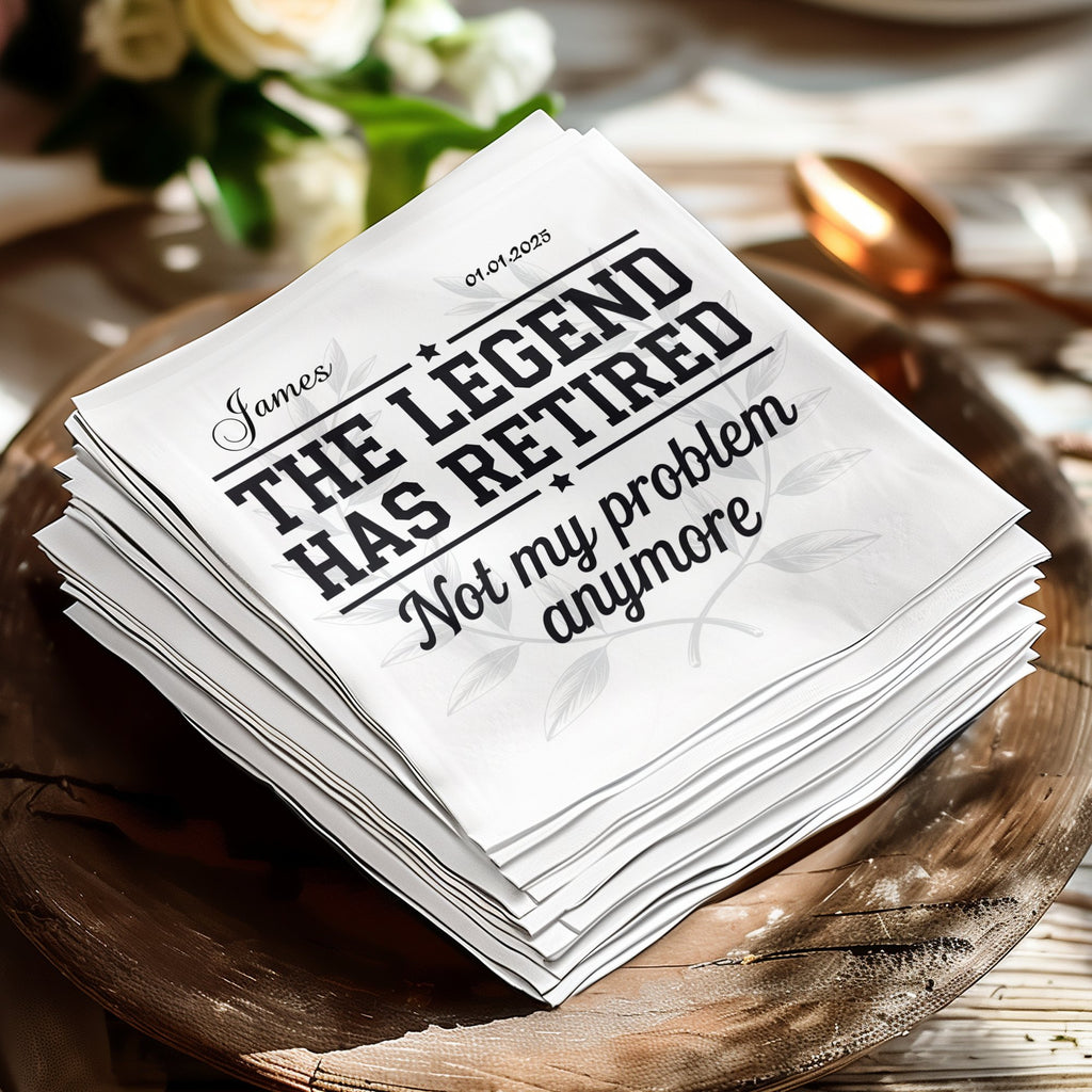 White cocktail napkins with "The Legend Has Retired Not my problem anymore" text.