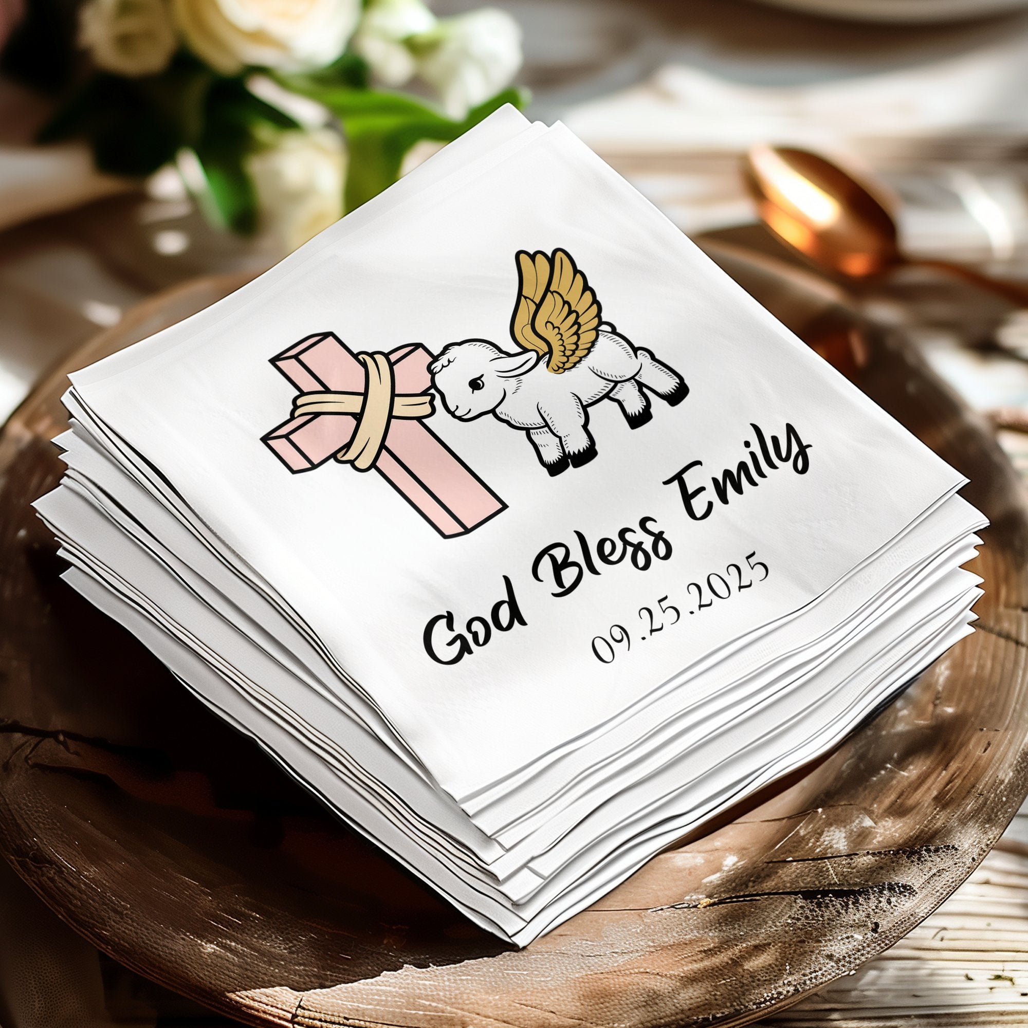 Napkins with a cross, lamb with wings, and "God Bless Emily 09.25.2025".