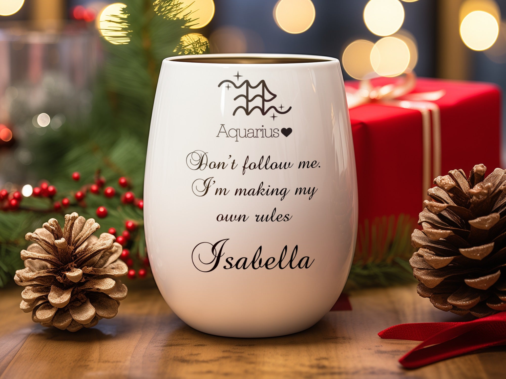 White wine glass with "Aquarius. Don't follow me. I'm making my own rules Isabella" text.
