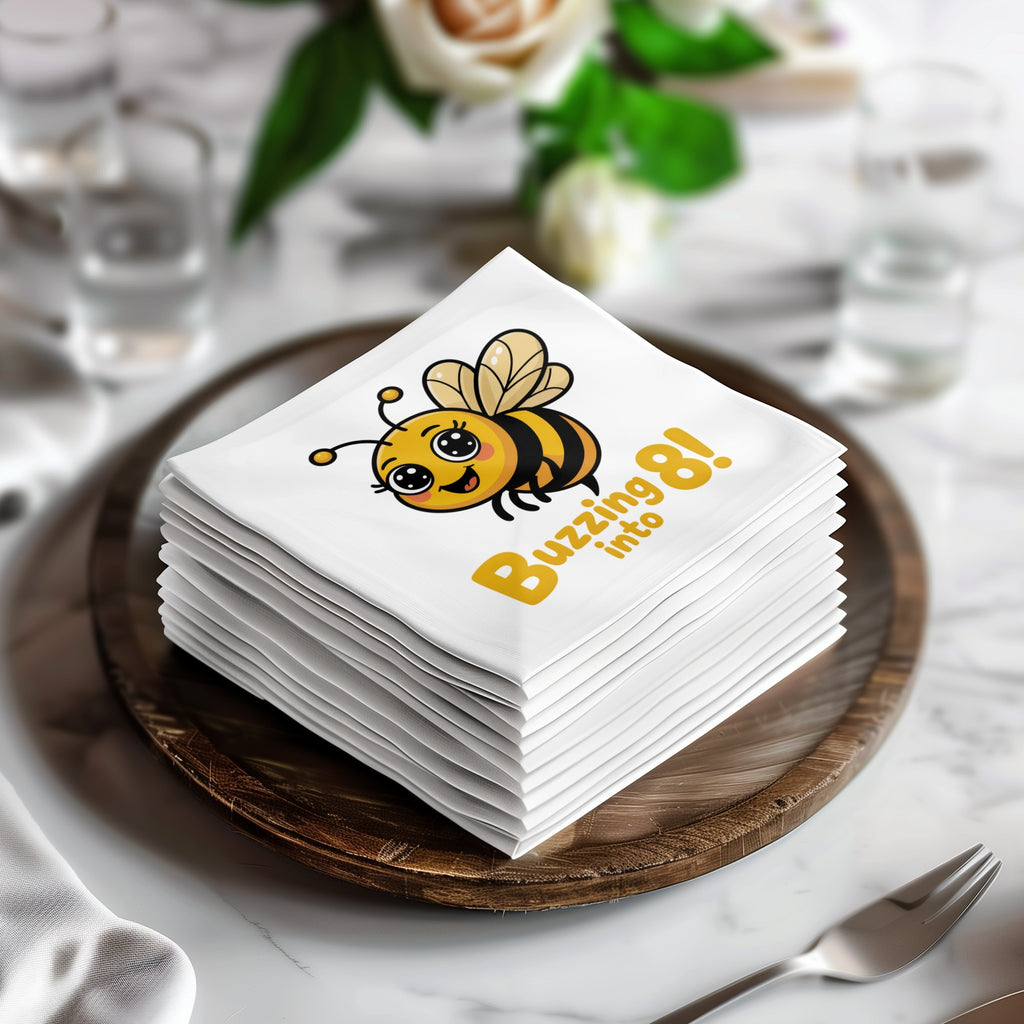 Stack of white napkins with a cartoon bee and "Buzzing into 8!" text.