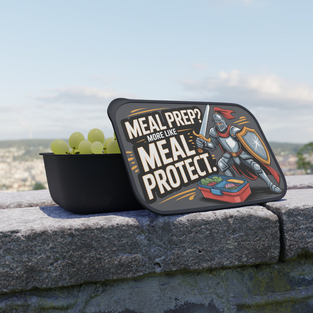 Black lunchbox with knight illustration and text "MEAL PREP? MORE LIKE MEAL PROTECT."