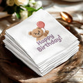 White napkin with teddy bear holding a pink balloon and "Happy Birthday!" text.