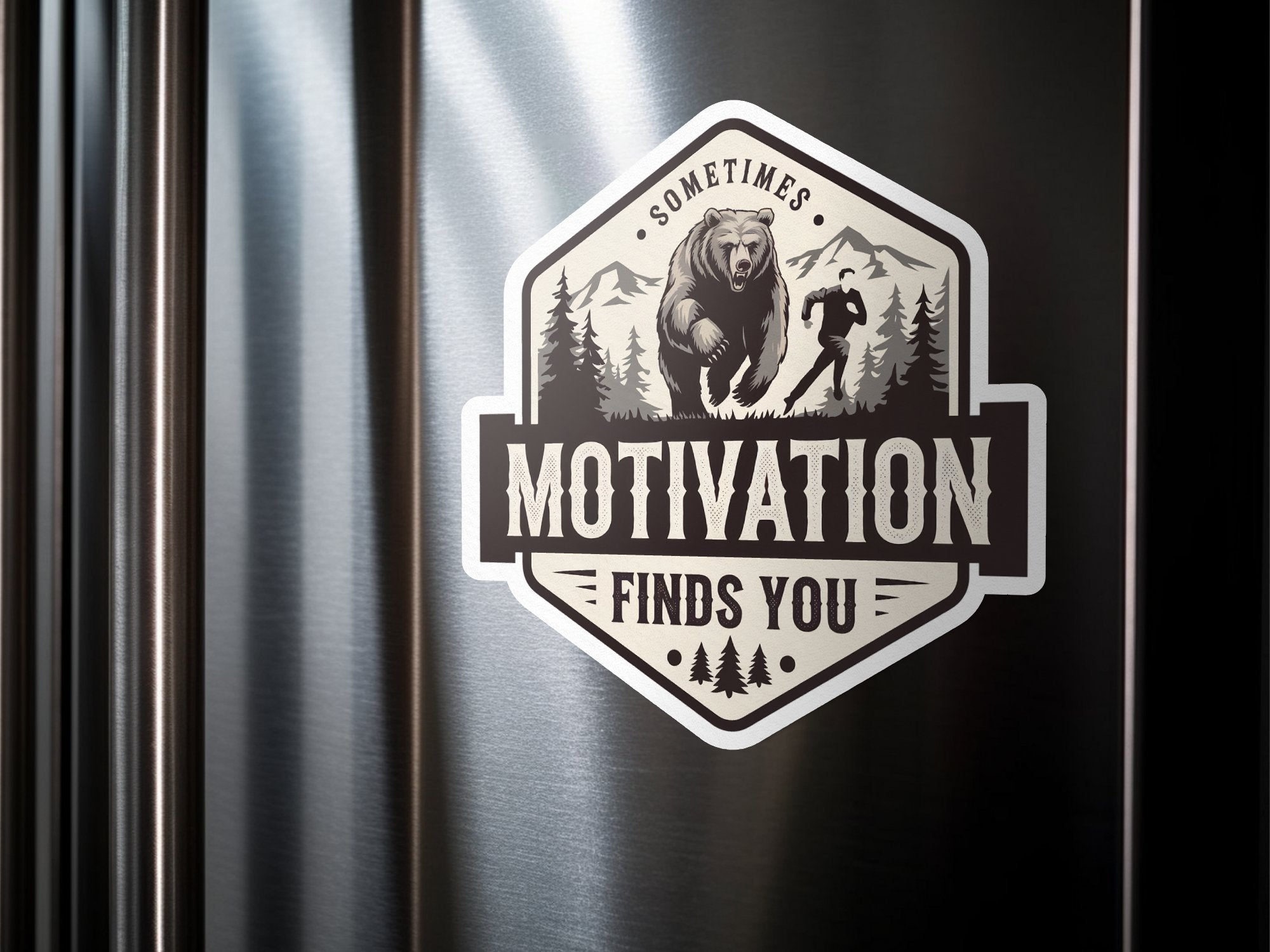 Bear and runner in mountains badge with "SOMETIMES MOTIVATION FINDS YOU" text.