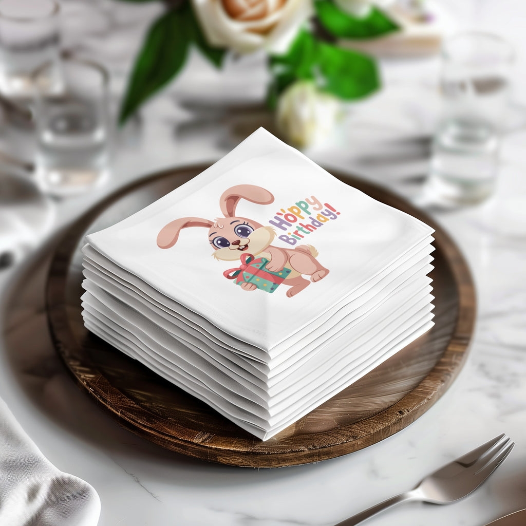 Stack of white napkins with pink bunny holding gift and "Hoppy Birthday!" text.