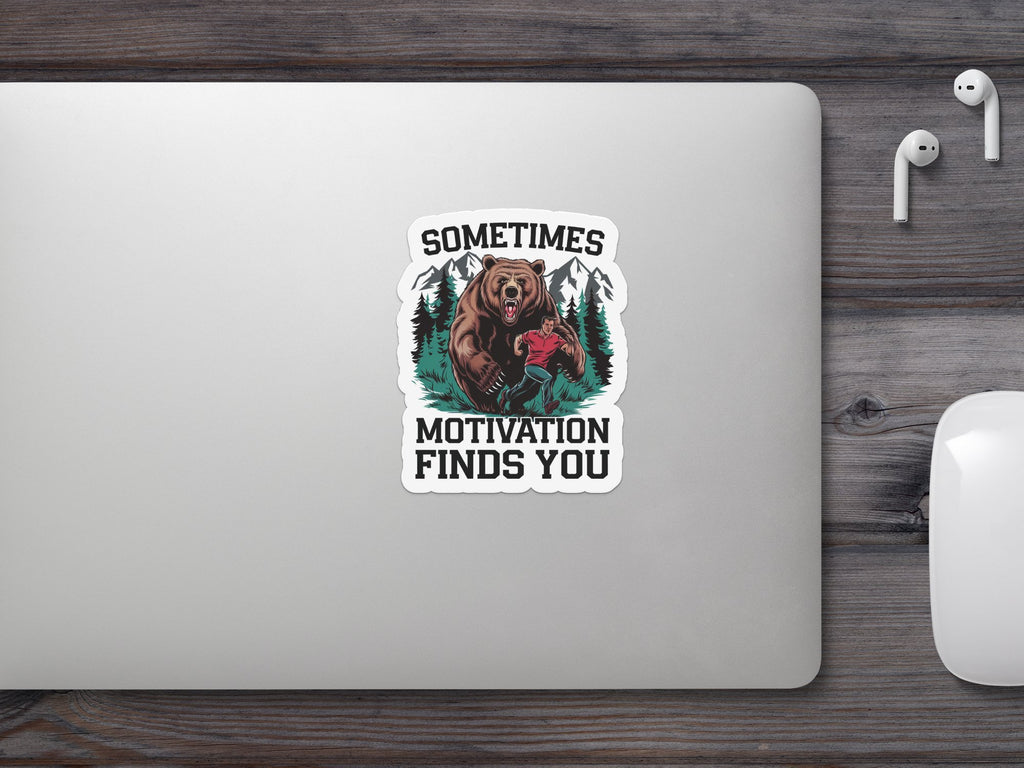 Sticker with bear and man, text "SOMETIMES MOTIVATION FINDS YOU".
