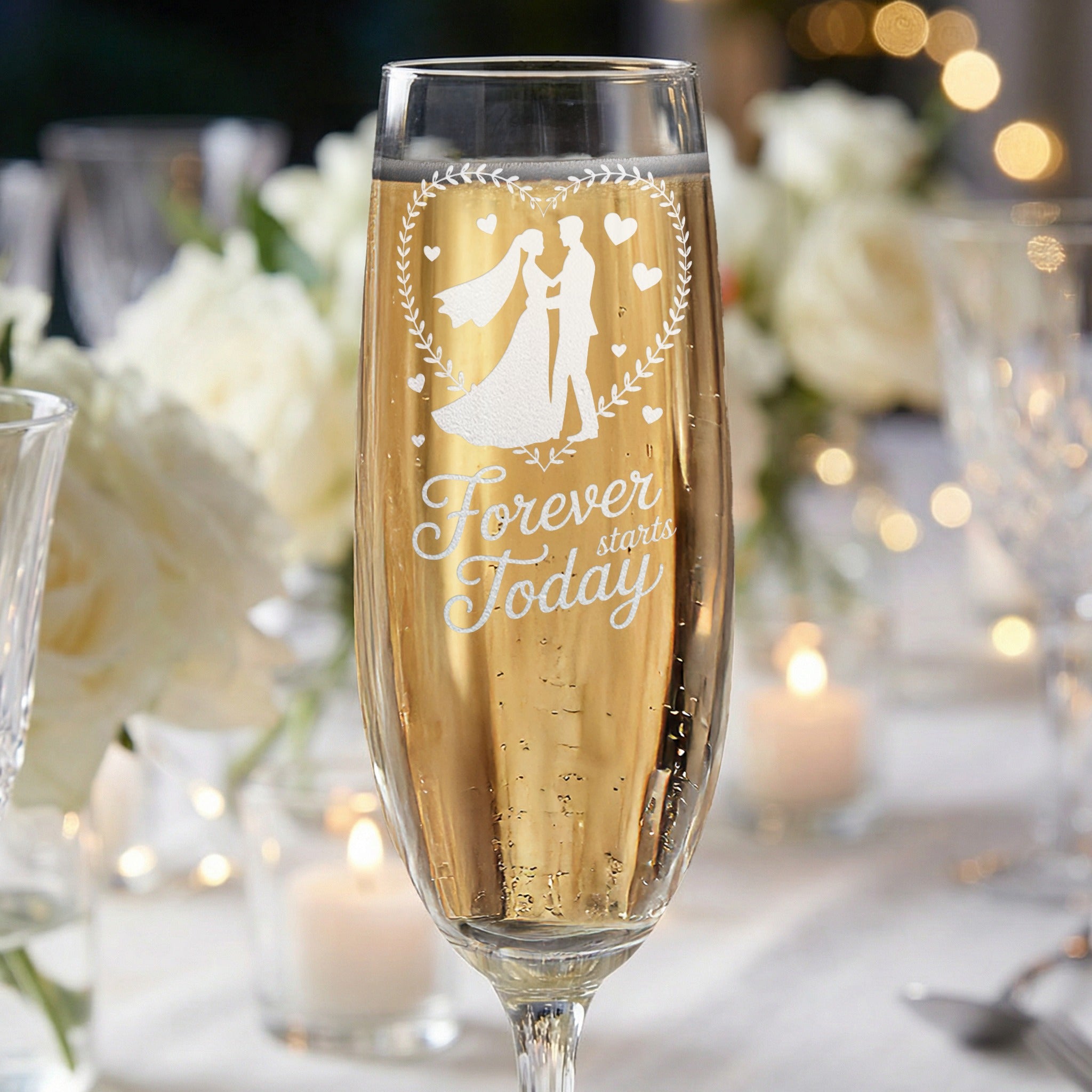 Champagne flute with wedding couple silhouette and text "Forever starts Today".