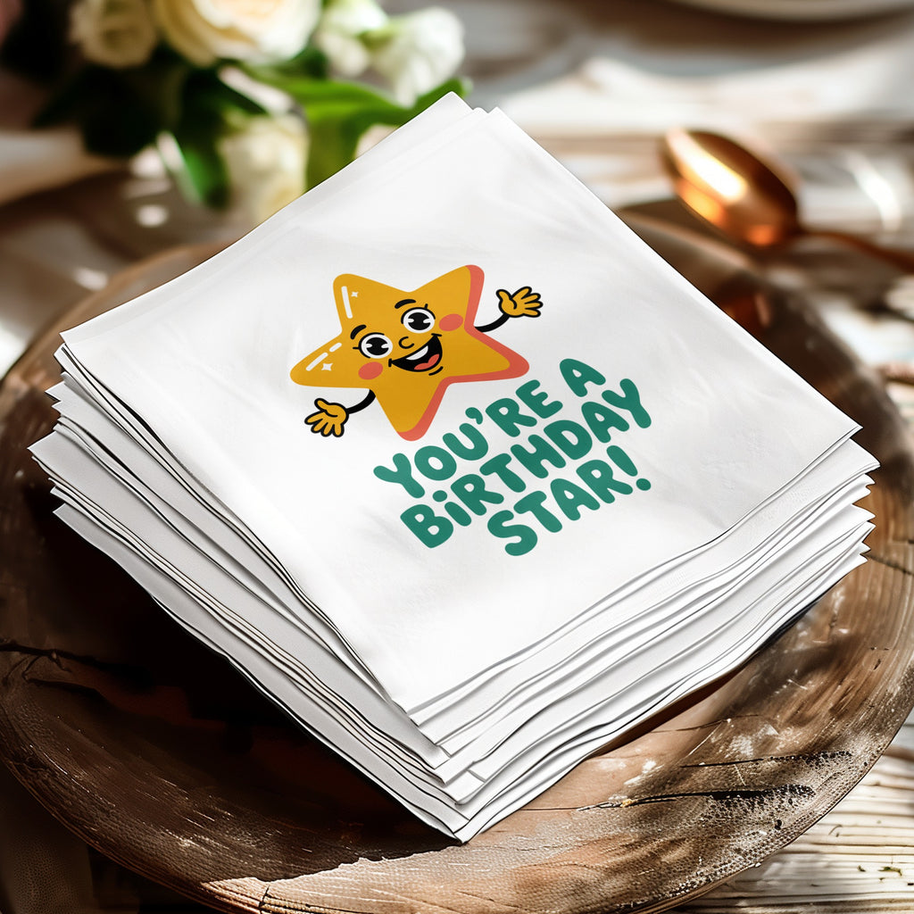 White cocktail napkin with a smiling cartoon star and "You're a birthday star!" text.