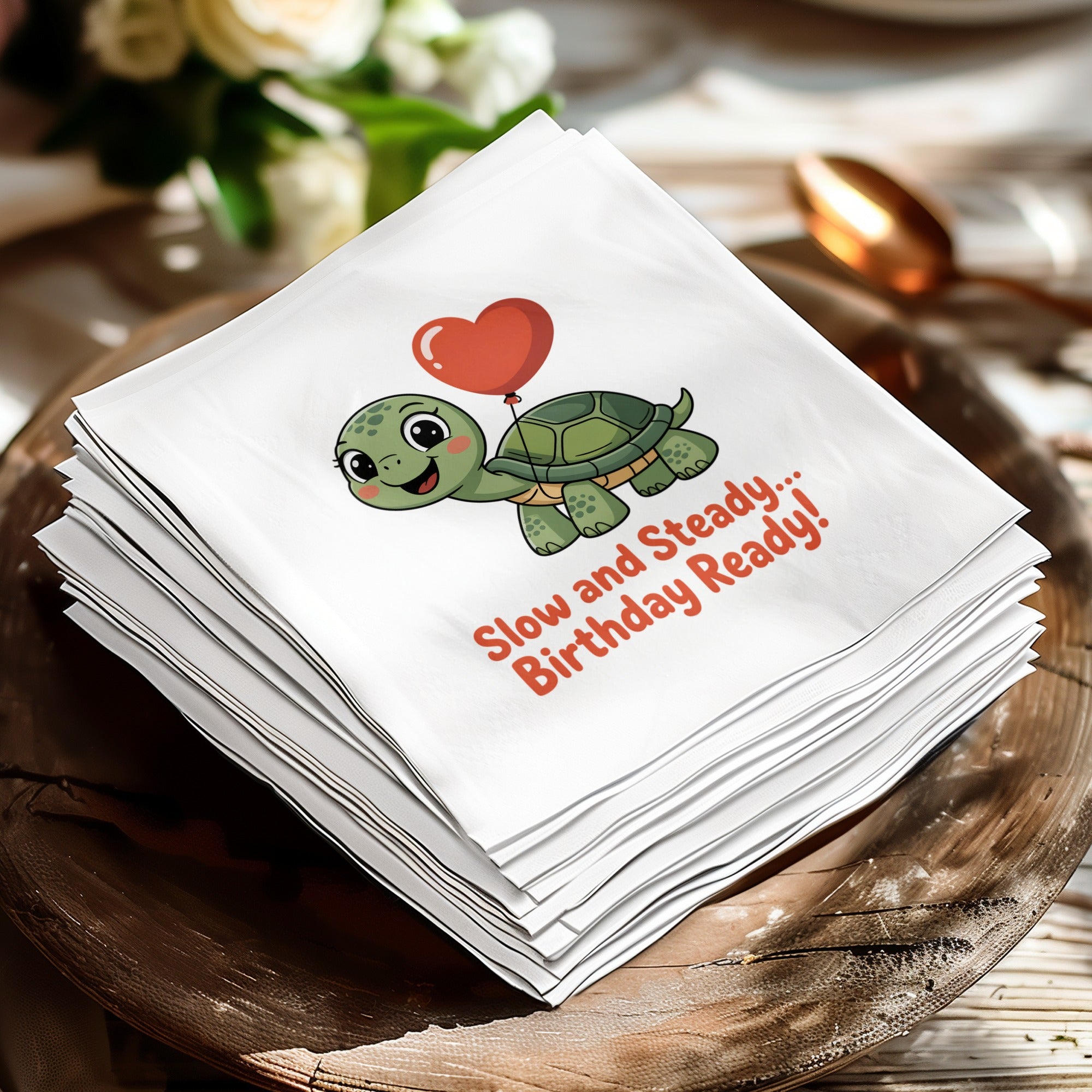 Stack of white napkins featuring a cartoon turtle and "Slow and Steady... Birthday Ready!" text.
