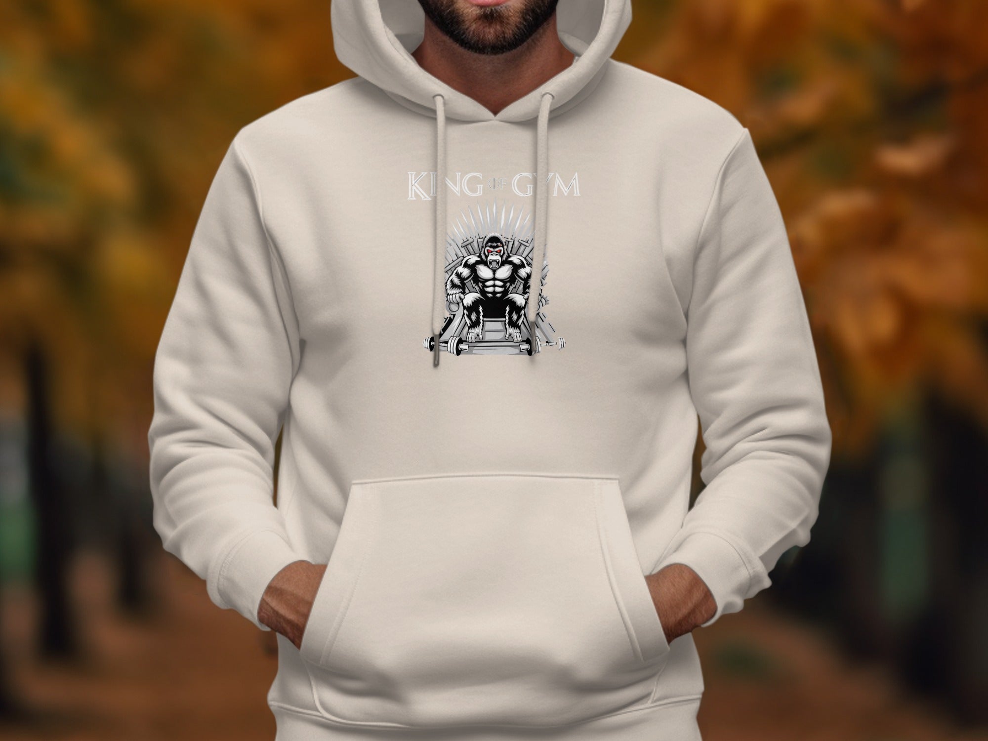 Cream hoodie featuring a gorilla on a weight machine and "KING of GYM" text.