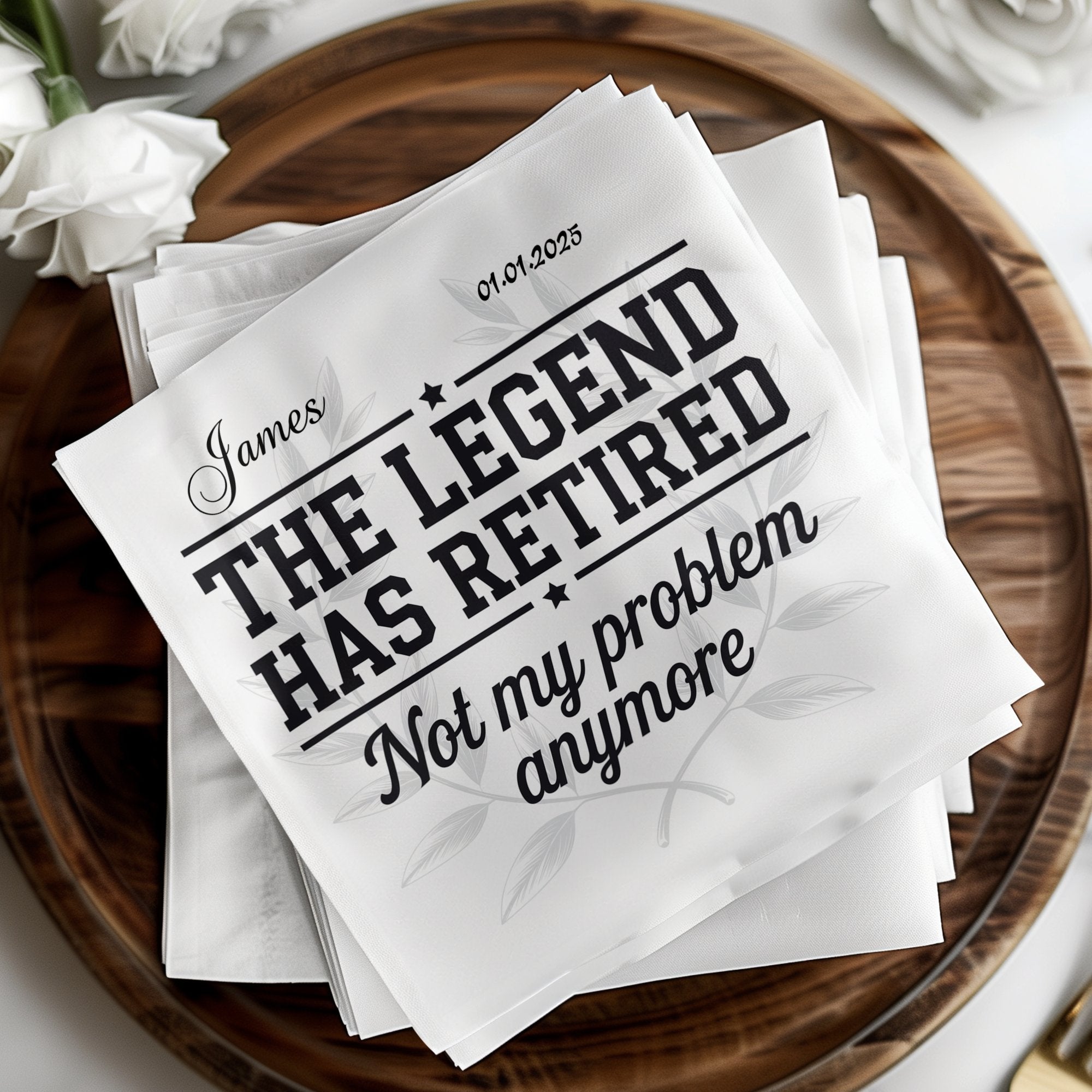 "The Legend Has Retired Not my problem anymore" text on white napkins with floral design.