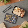 Black lunchbox with knight graphic, holding a sandwich, pistachios, and mandarin slices.