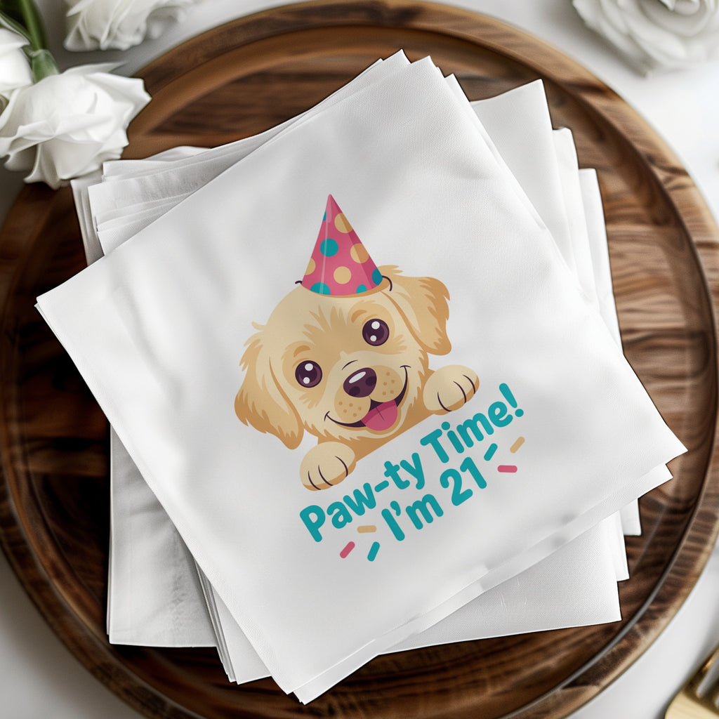 Golden retriever puppy wearing a party hat on a napkin saying "Paw-ty Time!"