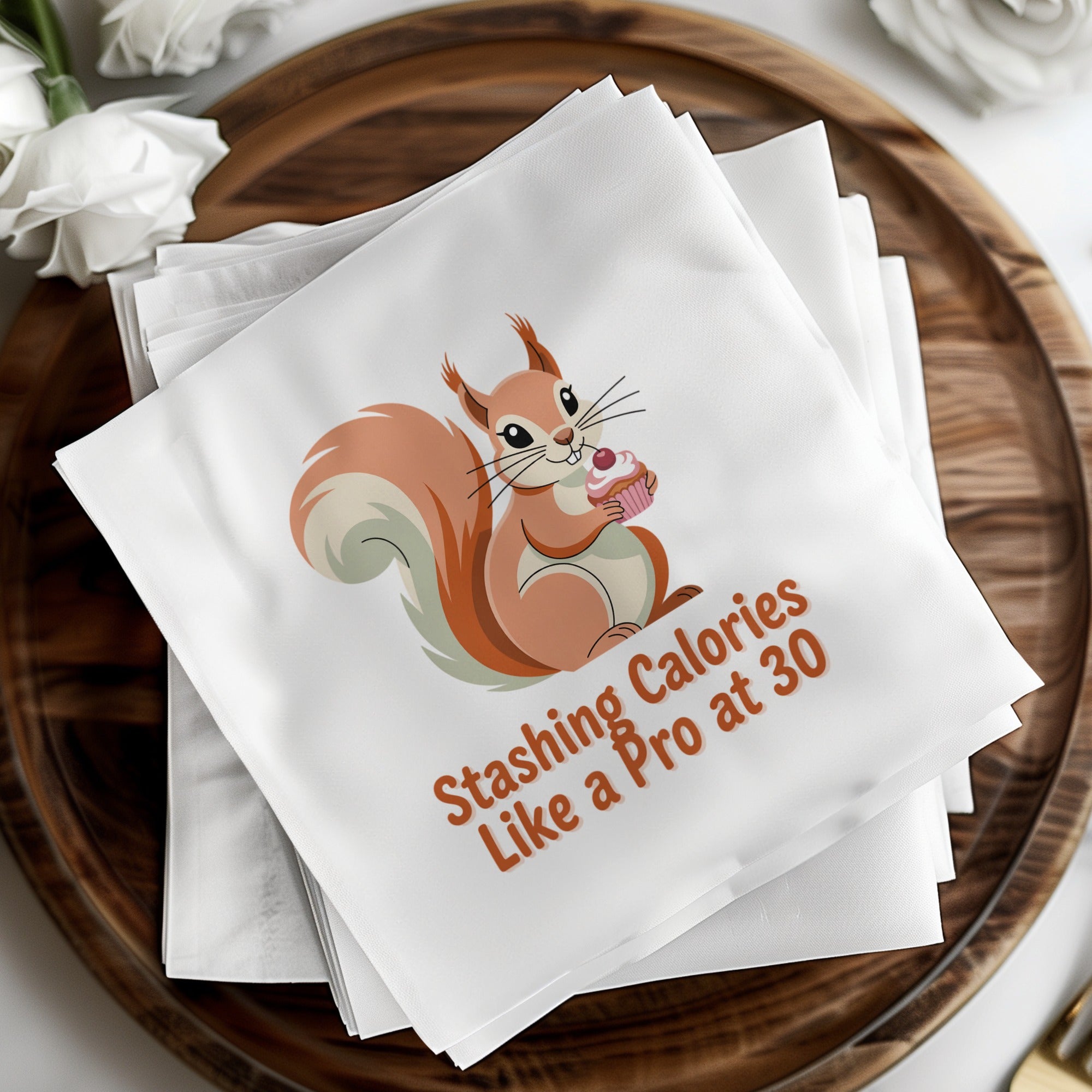 Napkins with a squirrel holding a cupcake and text "Stashing Calories Like a Pro at 30".