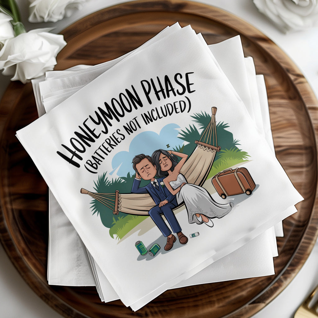 Napkins with cartoon of exhausted bride and groom in hammock, text reads "Honeymoon Phase (Batteries not included)".