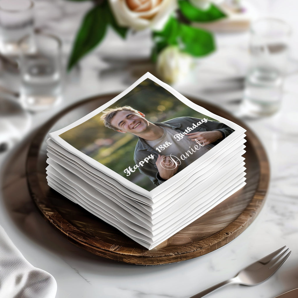 Stack of napkins with a photo of Daniel celebrating his 18th birthday.