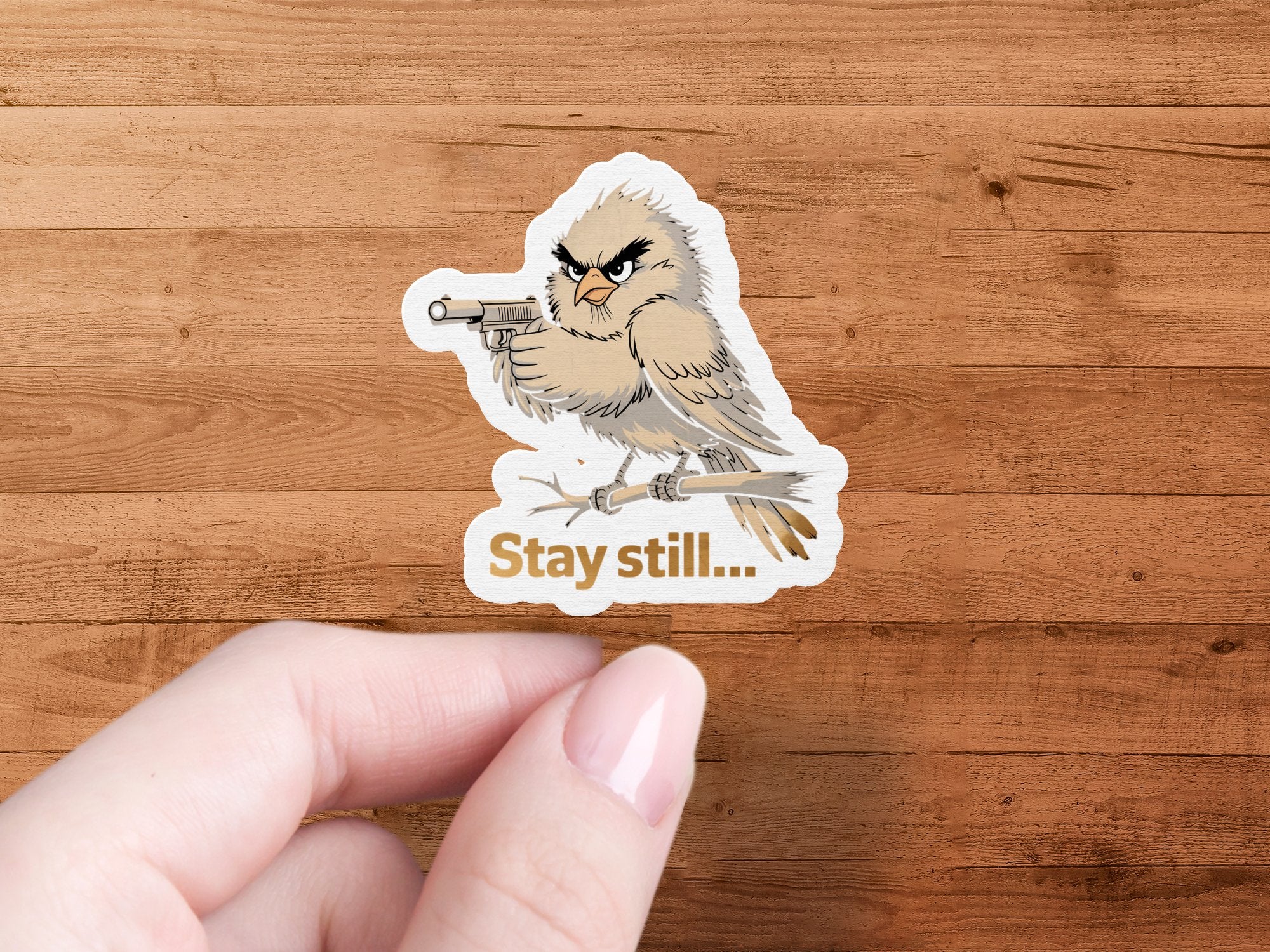 Furry bird with gun and text "Stay still..." on wood background.
